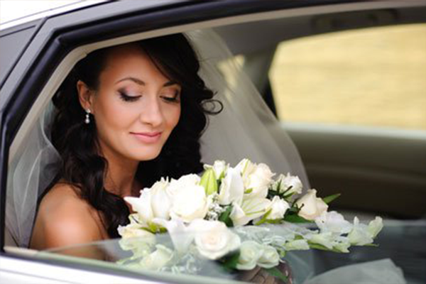 bride in wedding car